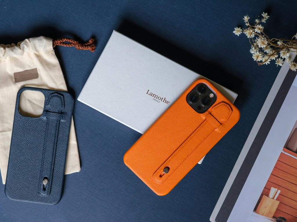 Smartphone displayed alongside cases and accessories on a counter