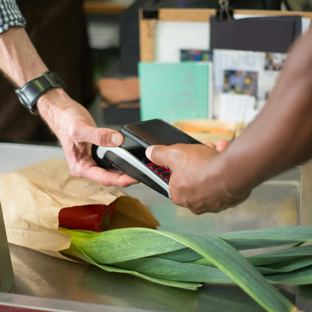 Customer being handed their phone back at the counter